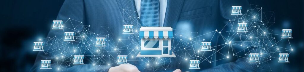 Profesional empresarial titular de una representaciÃ³n digital de una franquicia conectada a una red de otras tiendas.