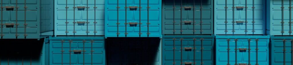 Descripción: Contenedores de envÃo azules apilados uno encima del otro, impulsando el crecimiento económico de México.
